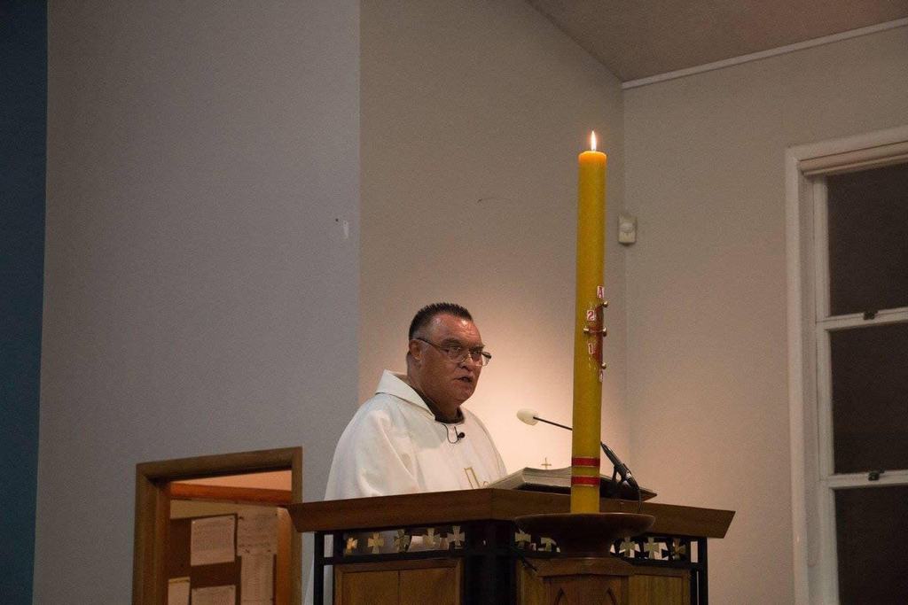 Beside the paschal candle
