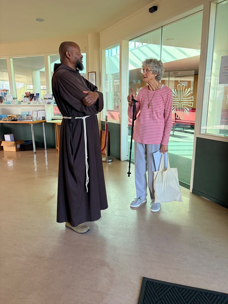 Greeting a parishioner